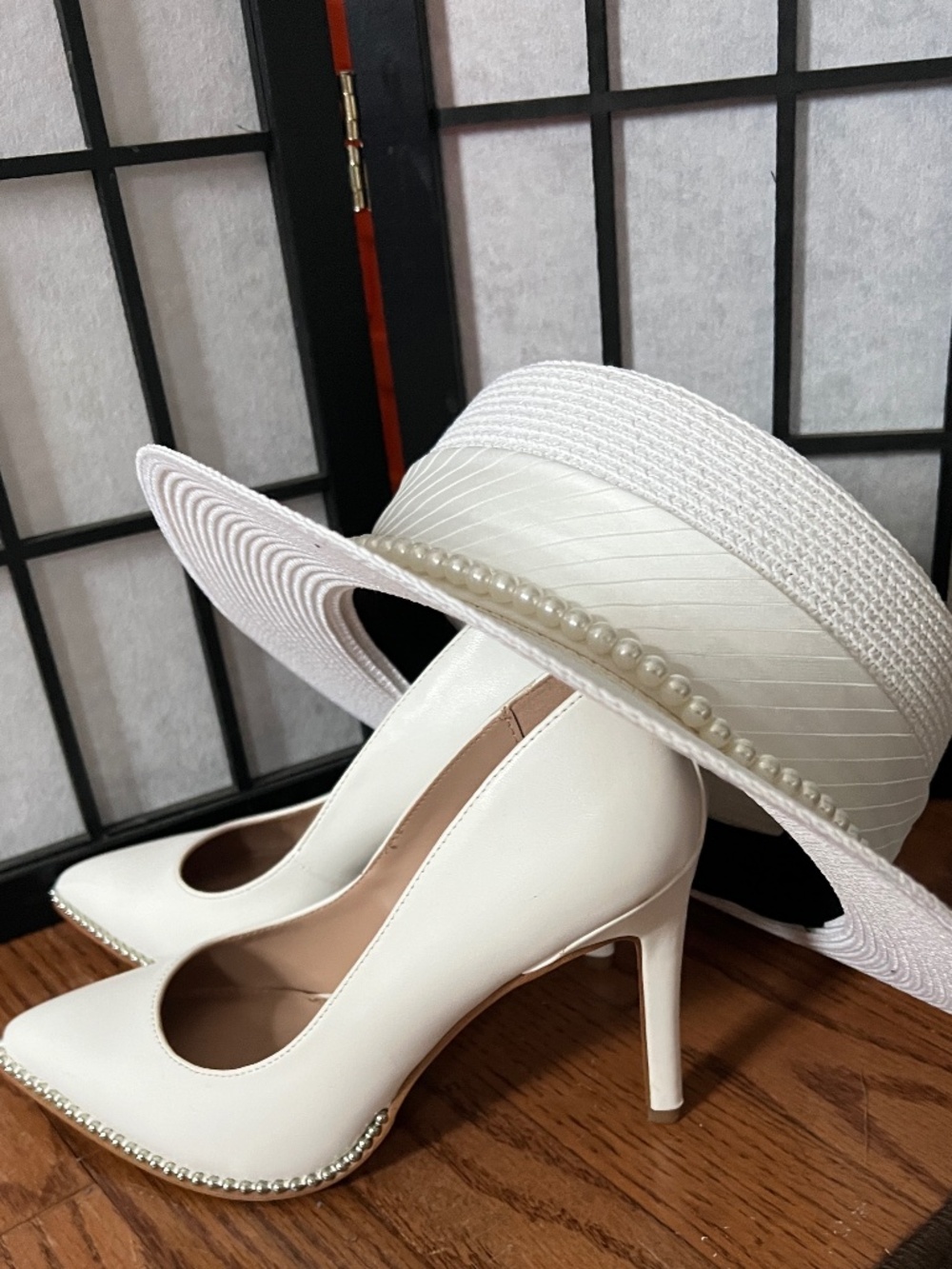 White heels with silver rhinestone accent